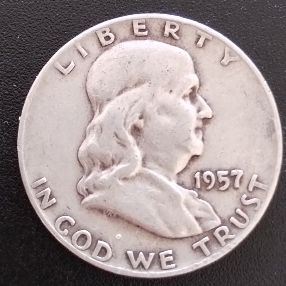 1957 D Ben Franklin Half Dollar.